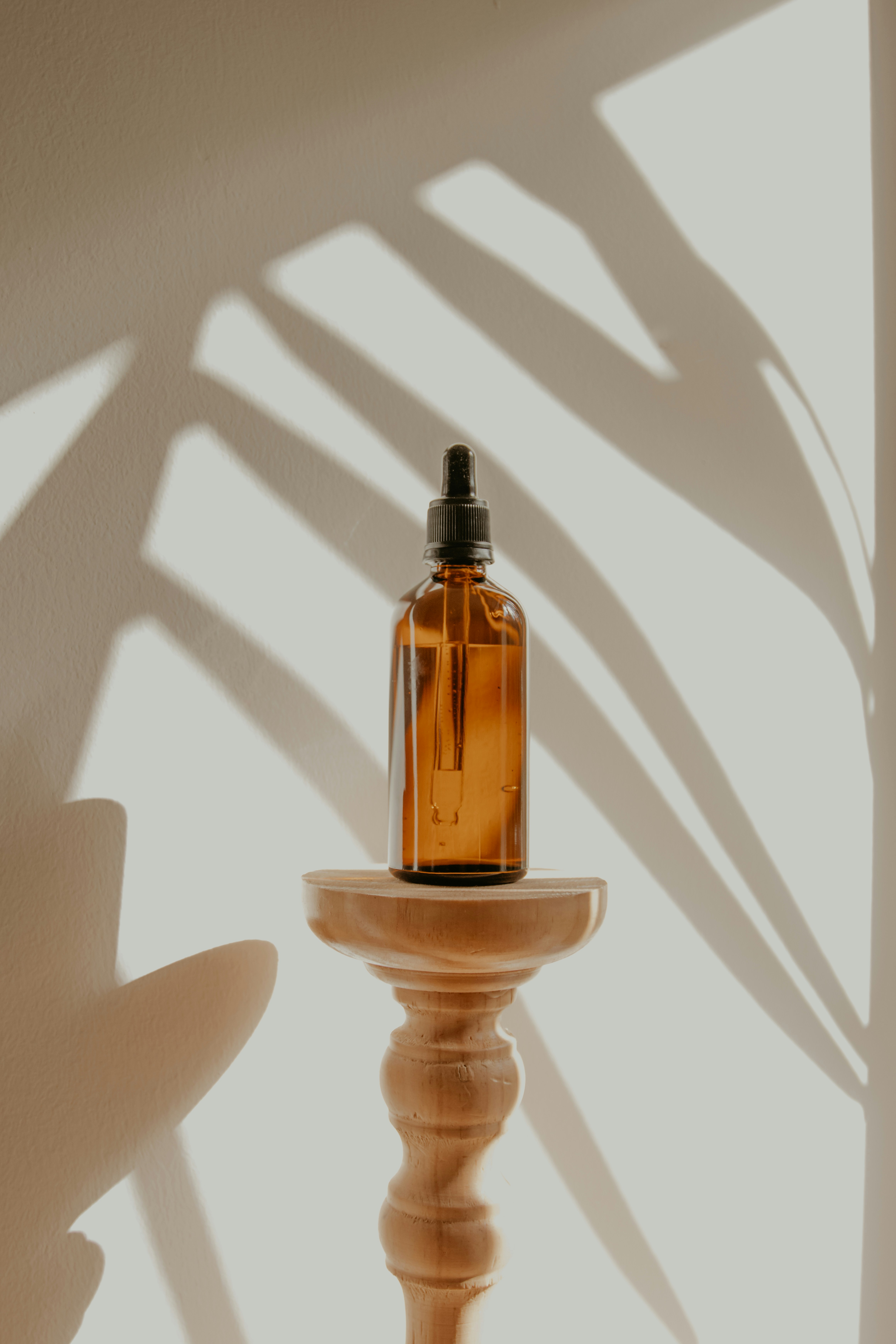 bottle of essential oil on a stool